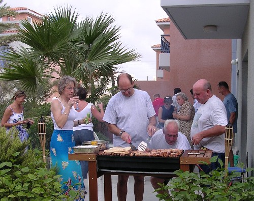 View of the terrace at party time at Iris Cottages